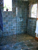 image of bathroom floor and shower wall